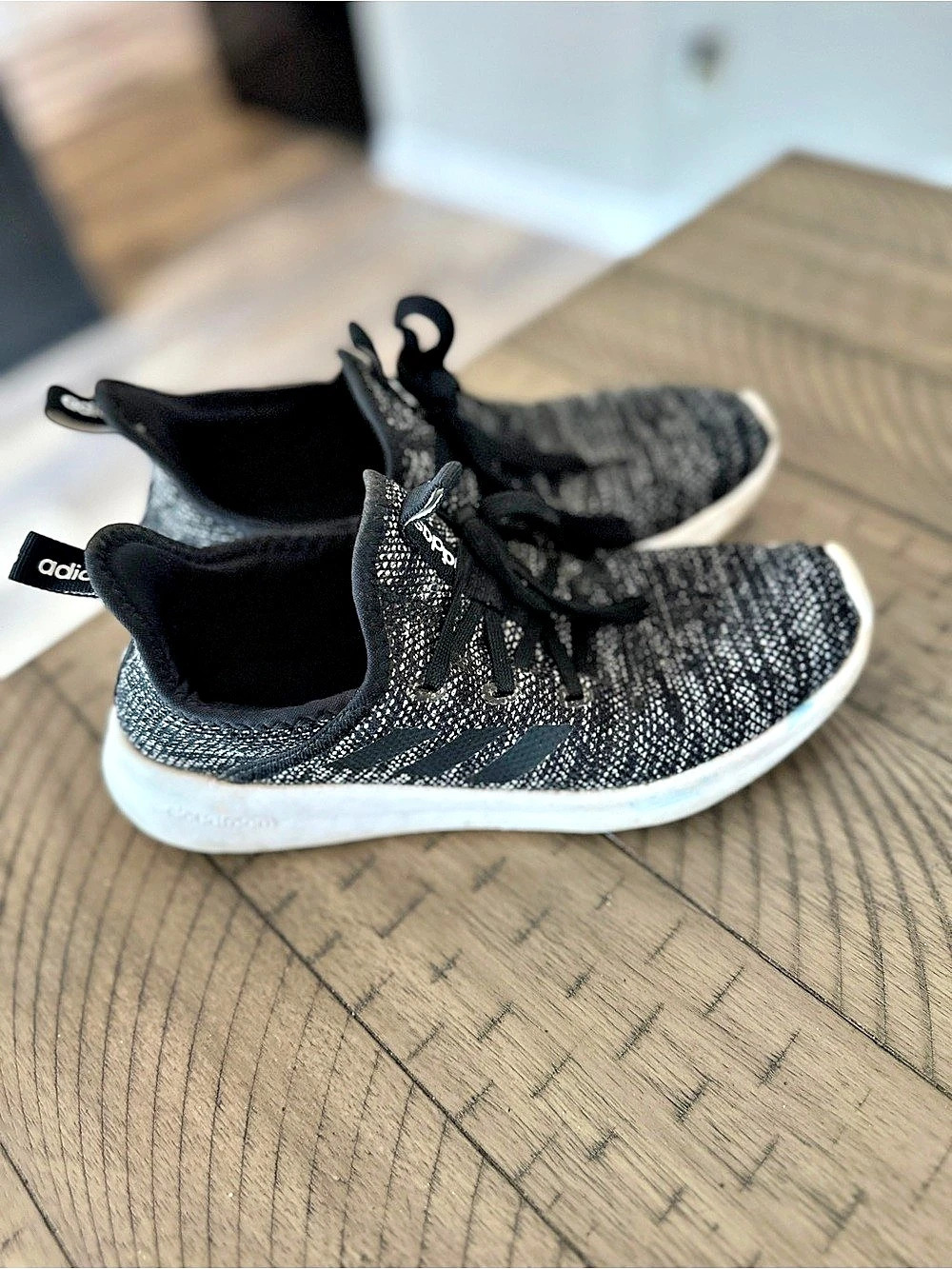 Used and well worn women’s Adidas cloudfoam Black & Gray Knit Sneakers, size 7